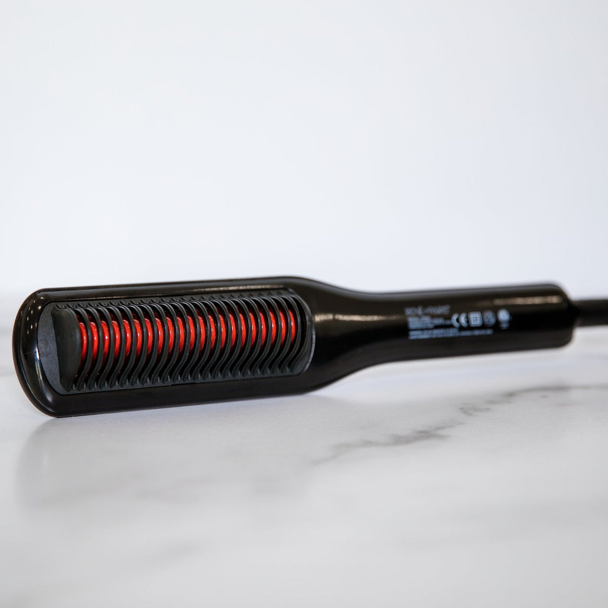 Heated styling comb flat iron